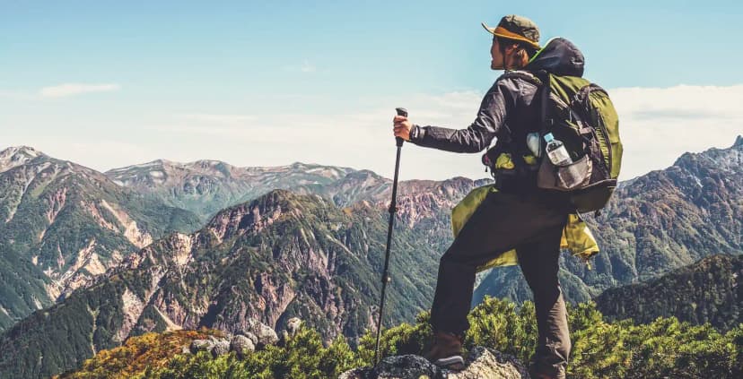 Hiker exploring remote landscape with connectivity solutions