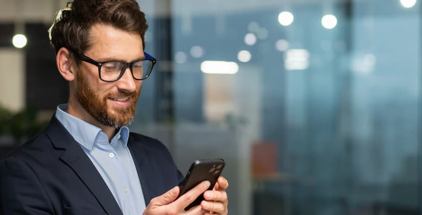 Financier using smartphone for global business connectivity