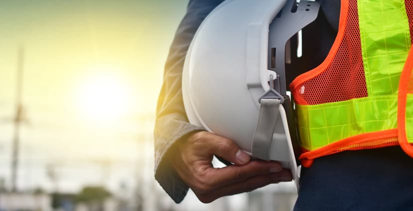 Worker carrying hard hat