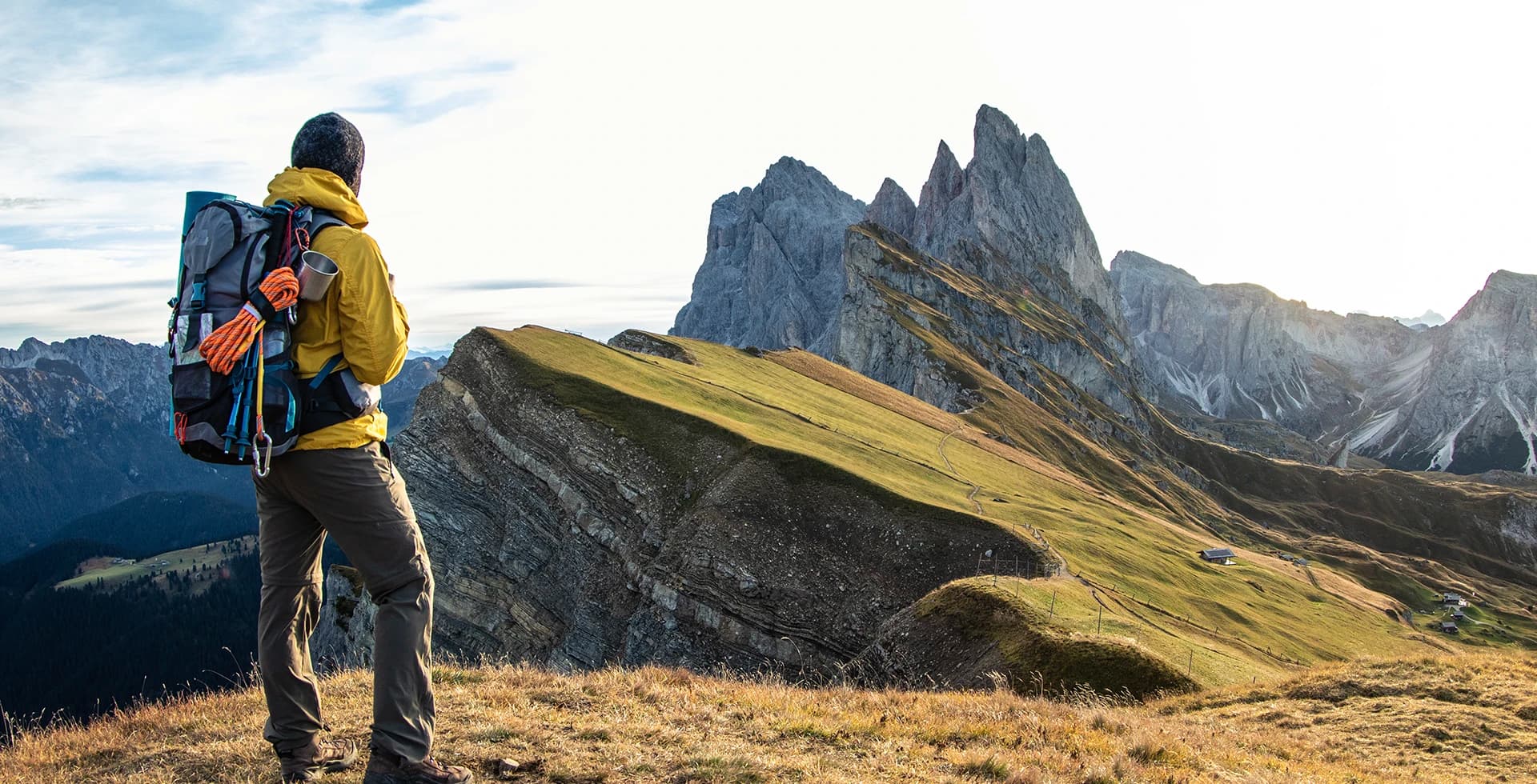 Young man hiking at sunrise.