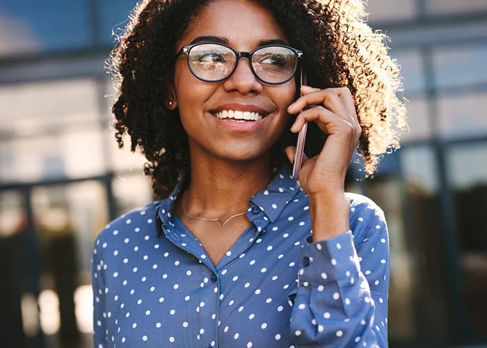 Businesswoman making a phone call outside