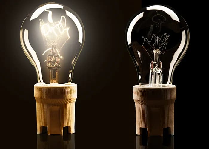 Two lightbulbs, one on and one off