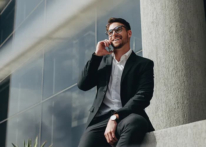 Businessman using smartphone.