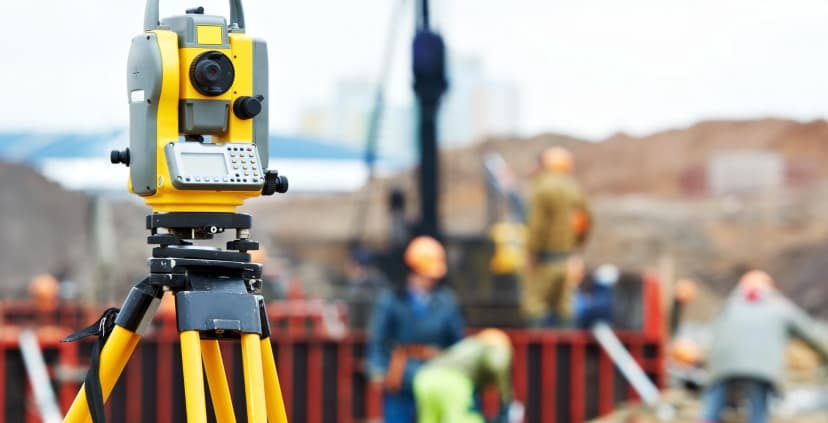 Theodolite on construction site.