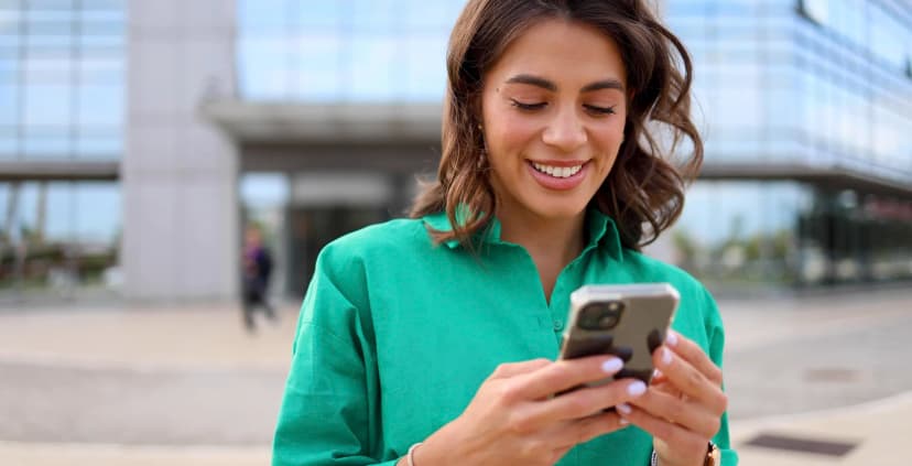 Photo of young businesswoman using a smartphone.