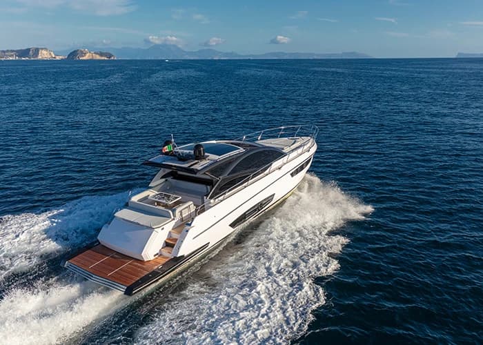 Luxury motor yacht navigating open water.